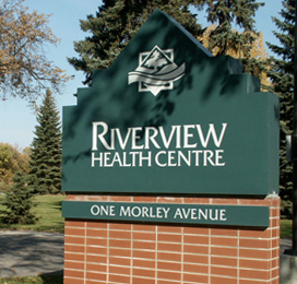 A sign reading Riverview Health Centre which is at the entrance to RHC.