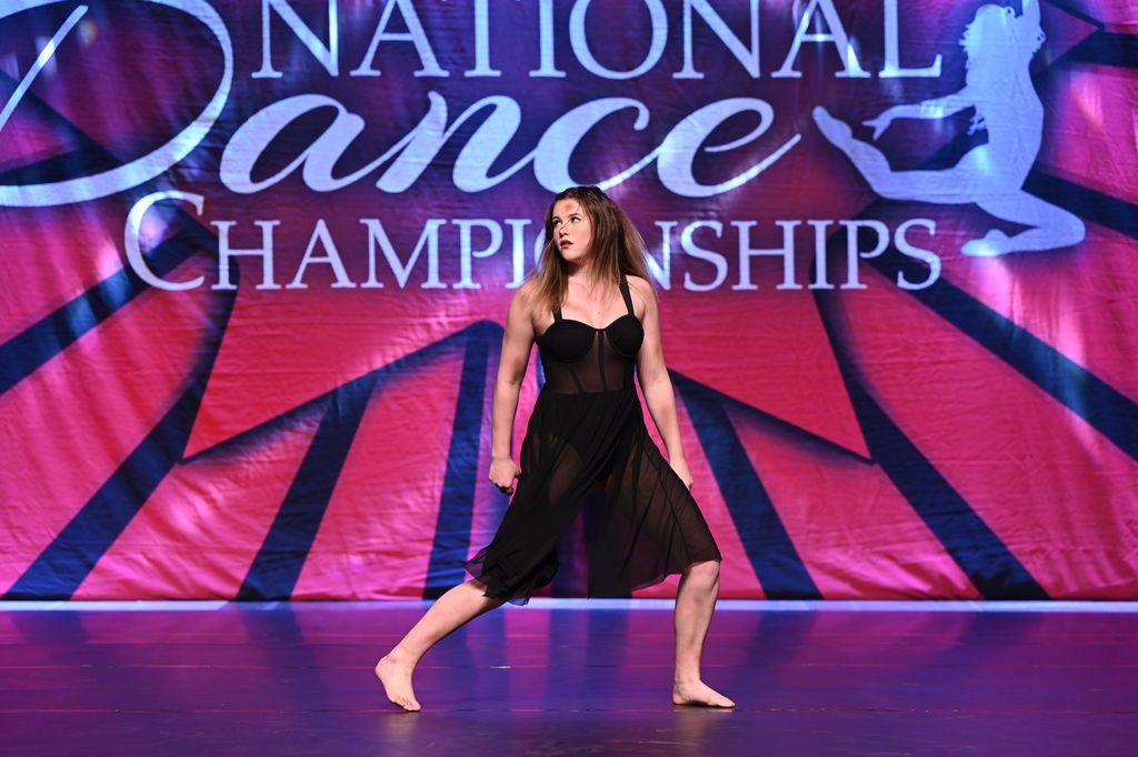 Kaitlyn dancing on stage at the National Dance Championships.