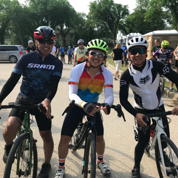 Three cyclists posing together at RHC before the ride begins.
