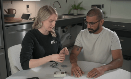 Image of two occupational therapists demonstrating how the FES treatment is used.